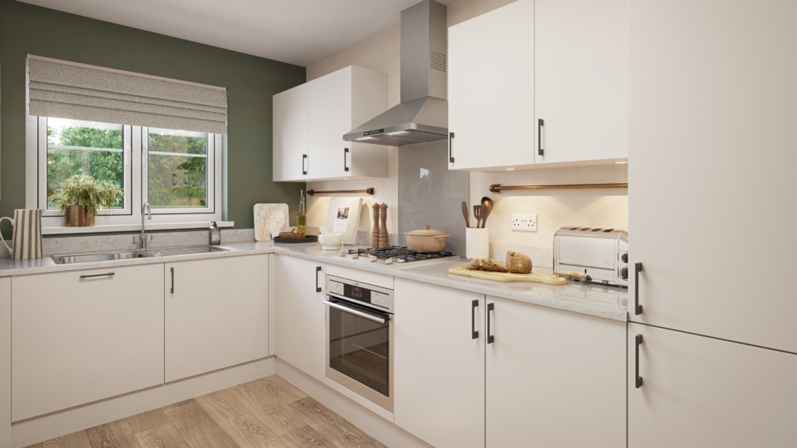 A modern kitchen with white cabinets, a stainless steel range hood, and a gas stovetop.