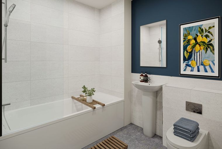 A bathroom with a bathtub, sink, and toilet.