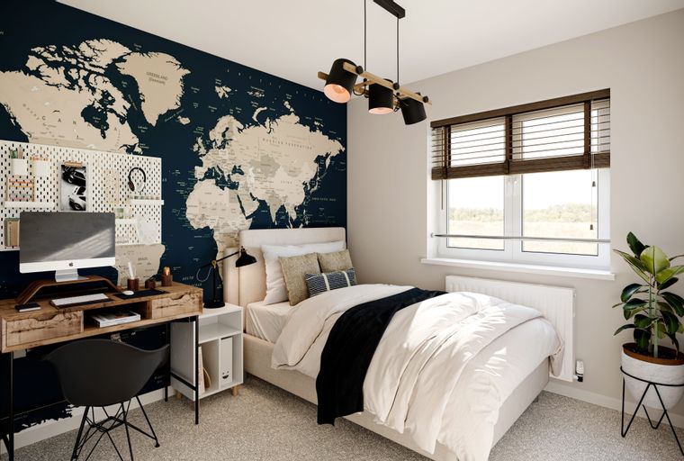 A bedroom with a bed, a desk, and a world map mural.