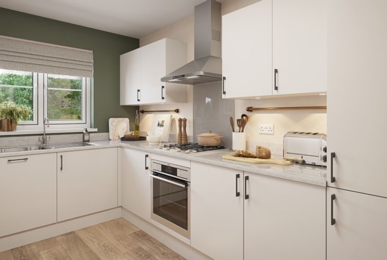 A modern kitchen with white cabinets, a stainless steel range hood, and a gas stovetop.