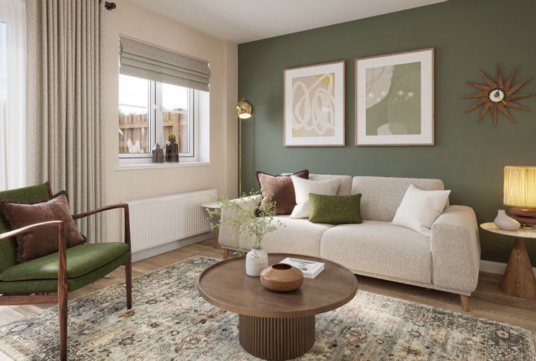 A living room with a sofa, armchair, coffee table, and artwork.