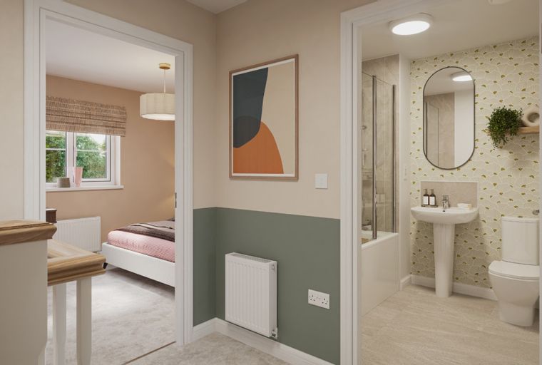 A hallway view into a bedroom and a bathroom.